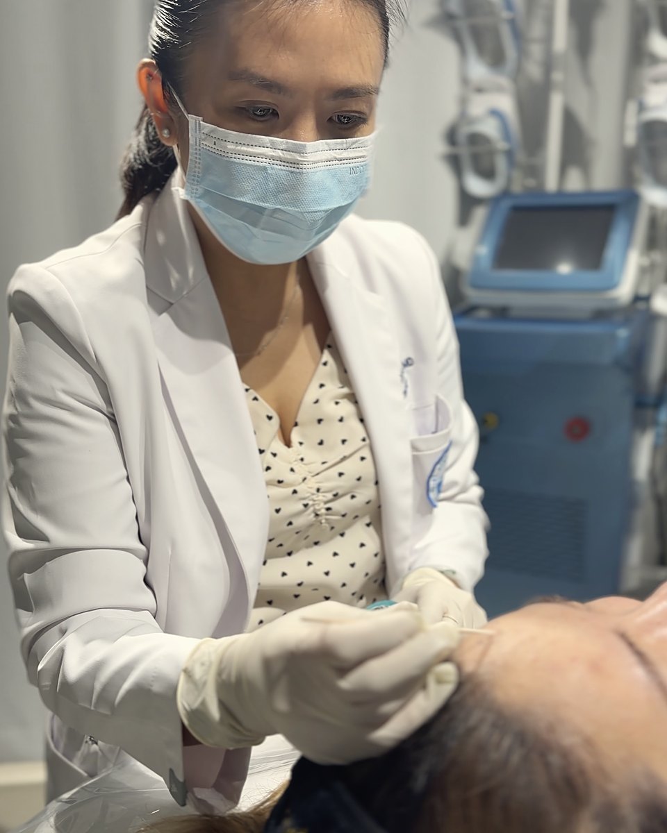 A physician performing a treatment at JPN Beauty Lounge