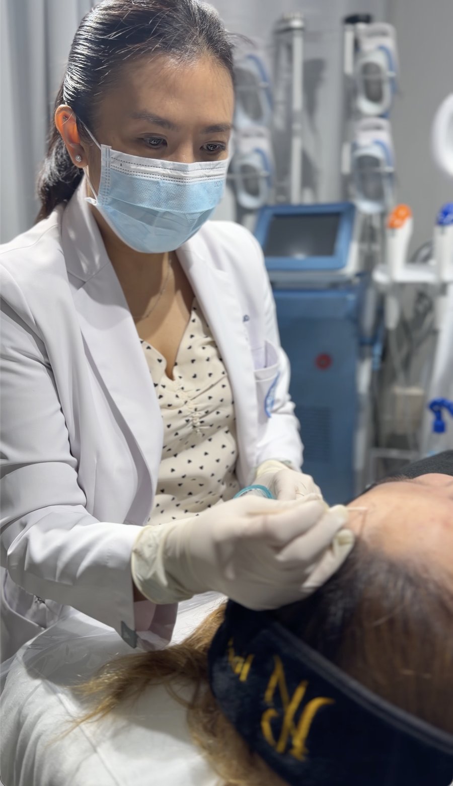 A clinician performing a dark spot treatment